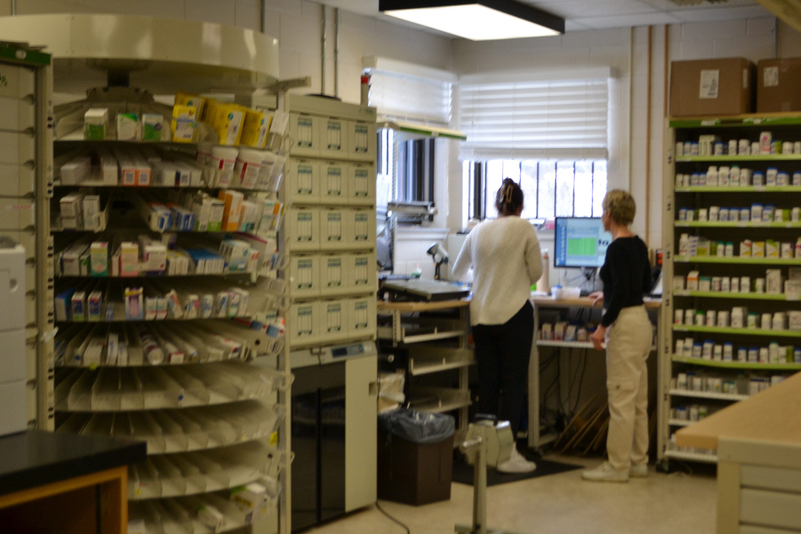 Photo of pharmacy with two females in the shot