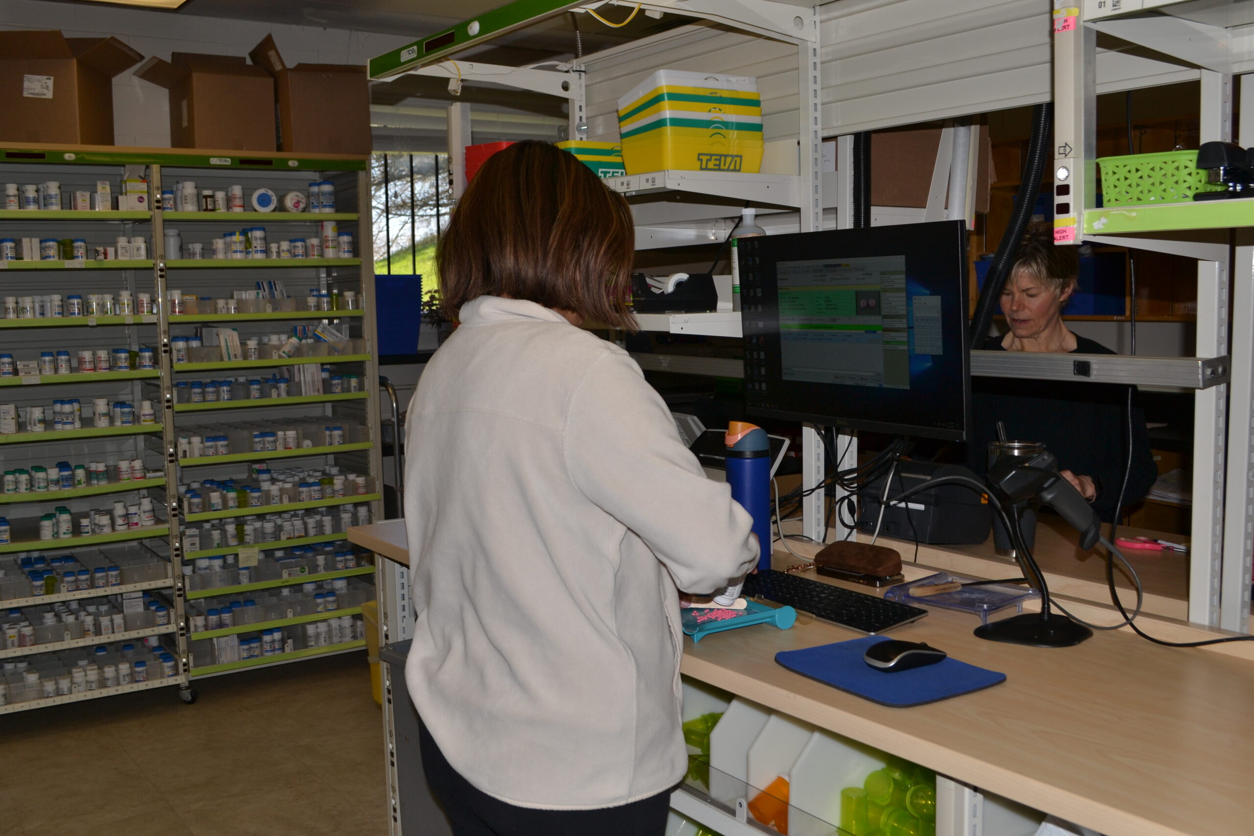 Photo of pharmacy with two females in the shot